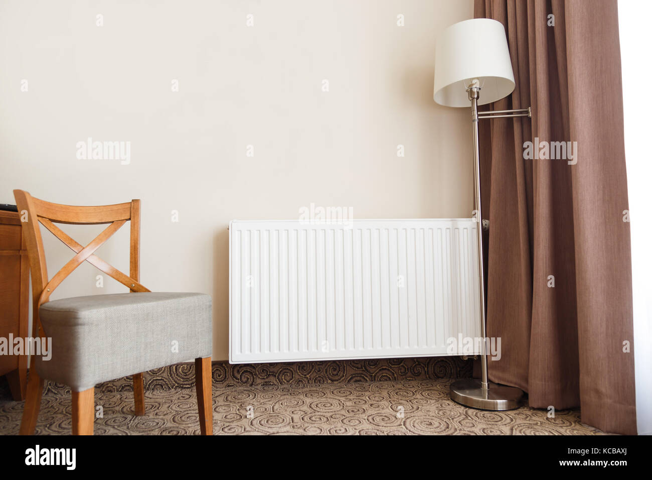Heating radiator in a cozy interior Stock Photo - Alamy