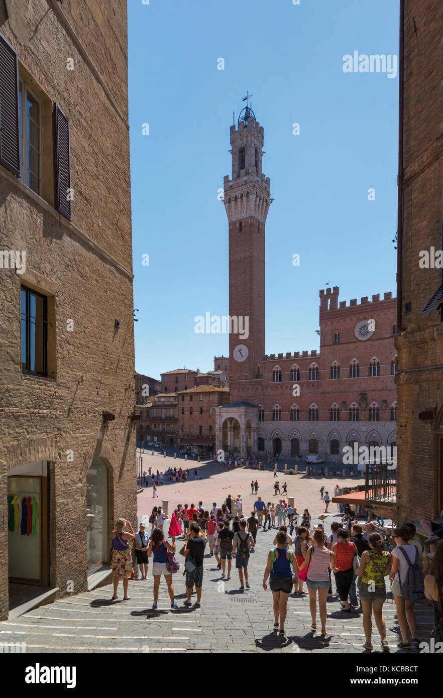 Siena, Siena Province, Tuscany, Italy.  The Palazzo Pubblico with the Torre de Mangia seen across the Piazza del Campo.  The Historic Centre of Siena  Stock Photo