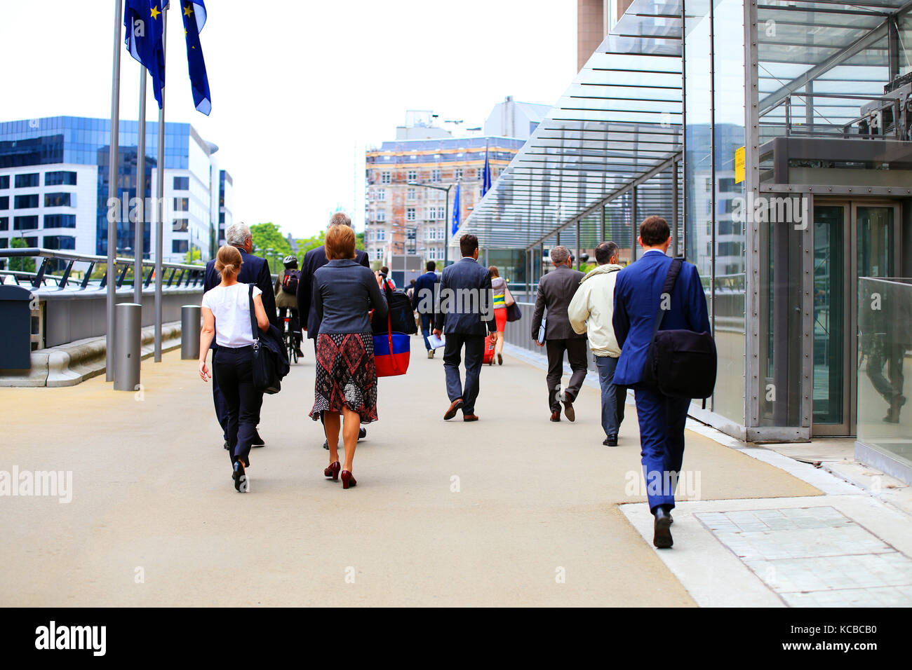 Workers of the European Parliament going to work in the morning. Business people in the street of Brussels. Stock Photo