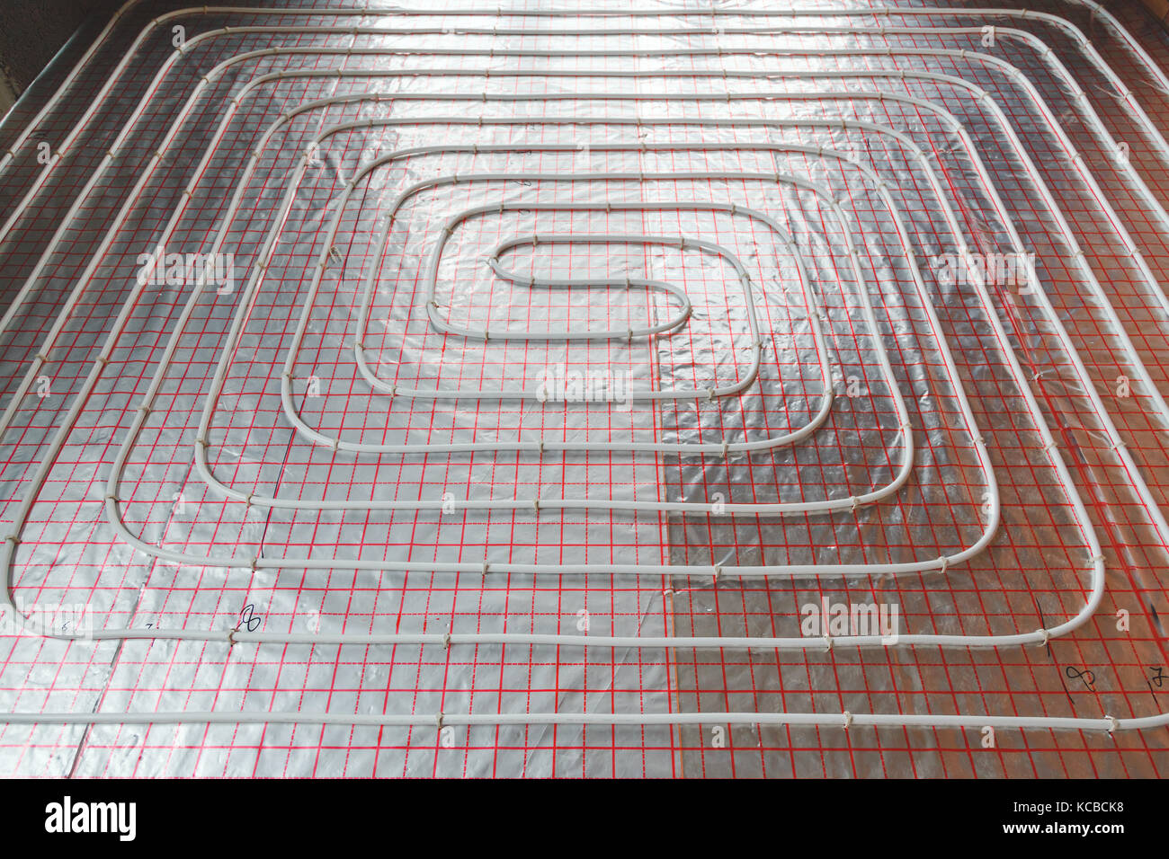 Underfloor heating installation. Close up on water floor system