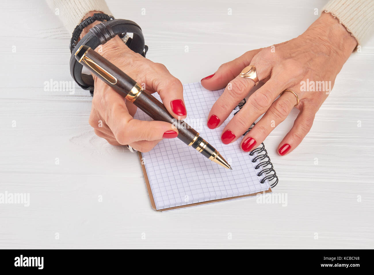 Female hands with luxury pen and notebook Stock Photo - Alamy