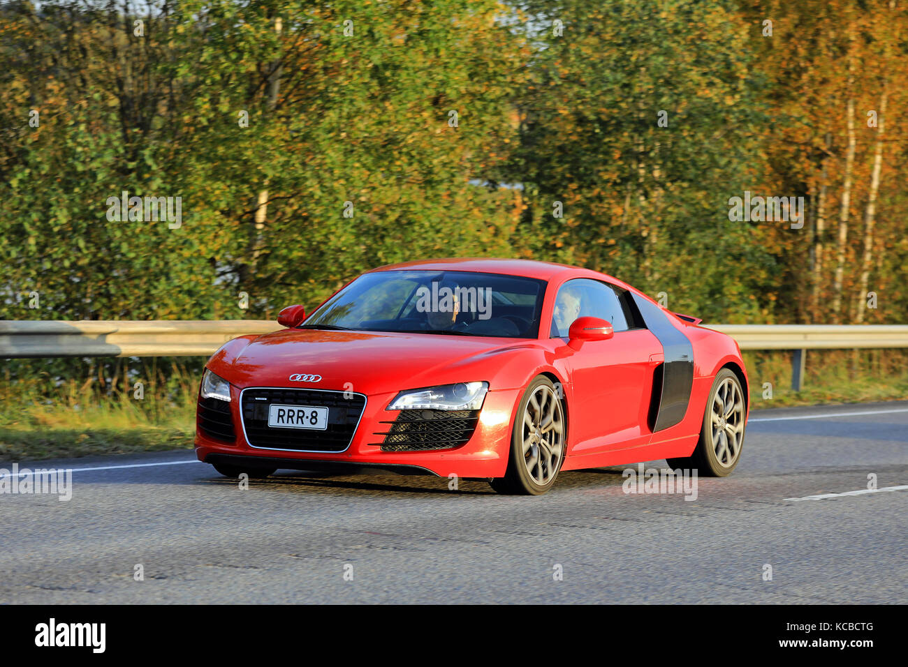 JYVASKYLA, FINLAND - SEPTEMBER 23, 2017: Beautiful Red Audi R8 at speed on highway in autumn. Stock Photo