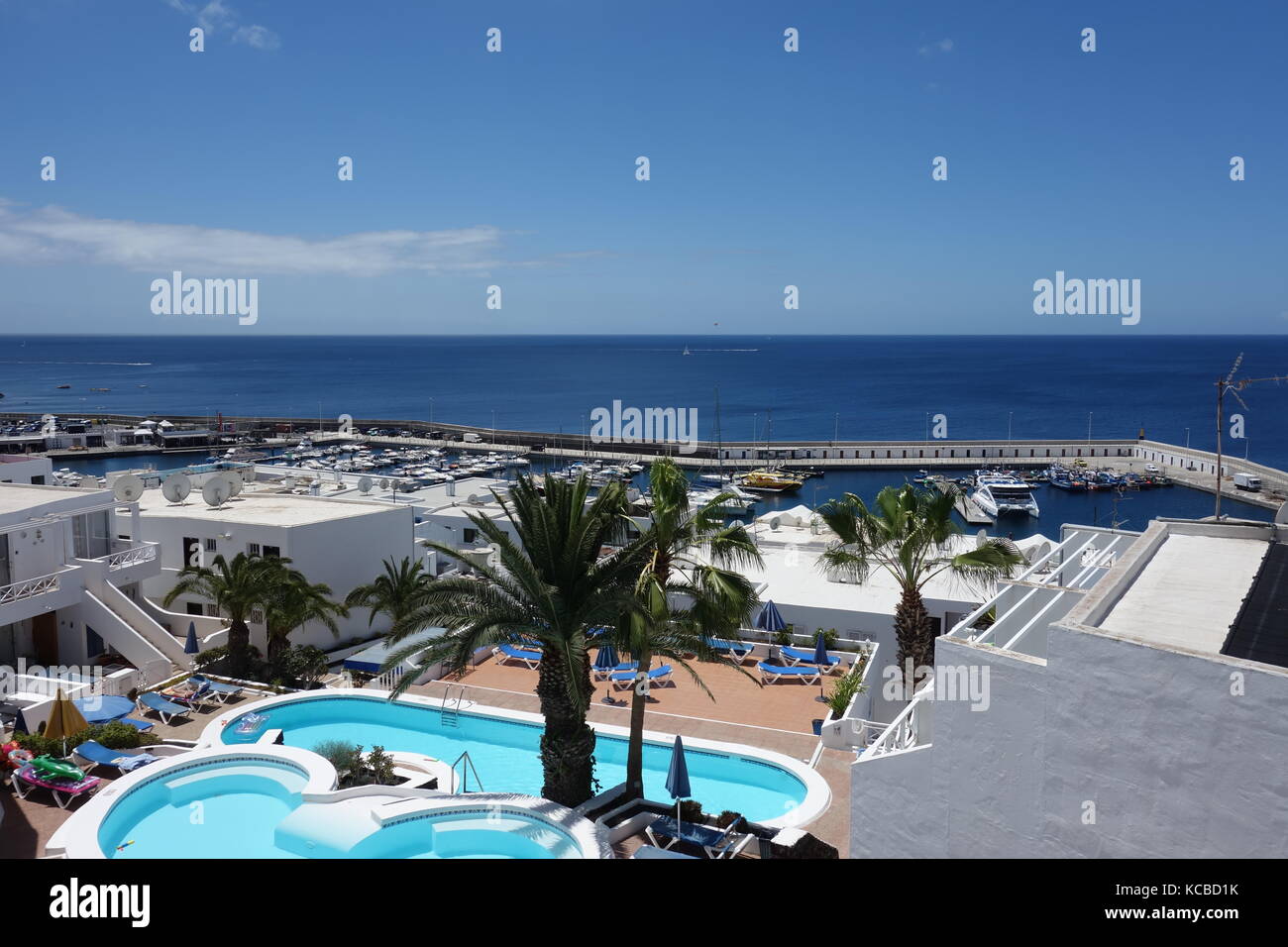 Views across Puerto del Carmen seafront and harbour, Lanzarote Stock Photo