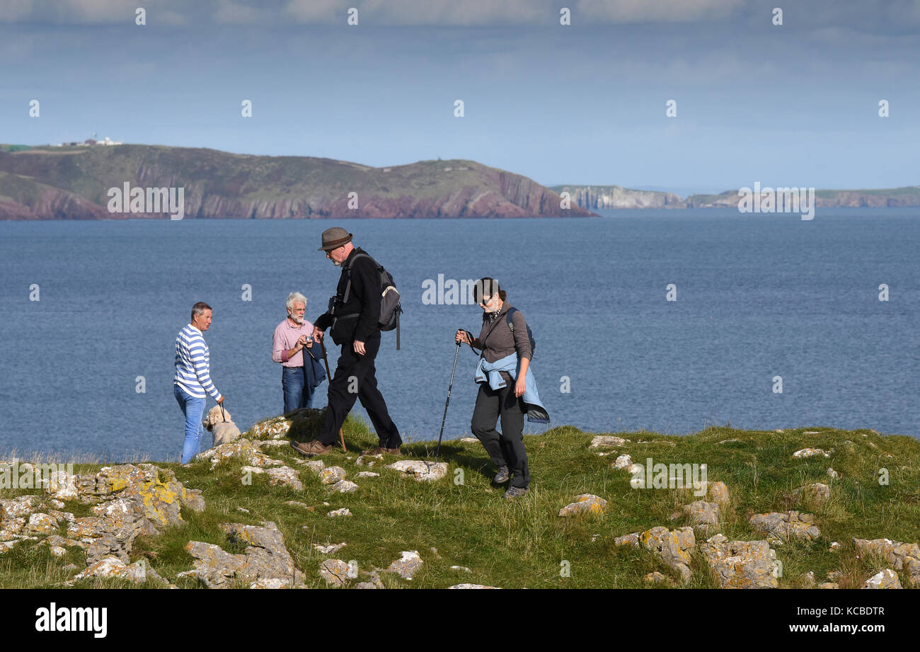 People walking Pembrokeshire Coast Path between Stackpole Quay and ...