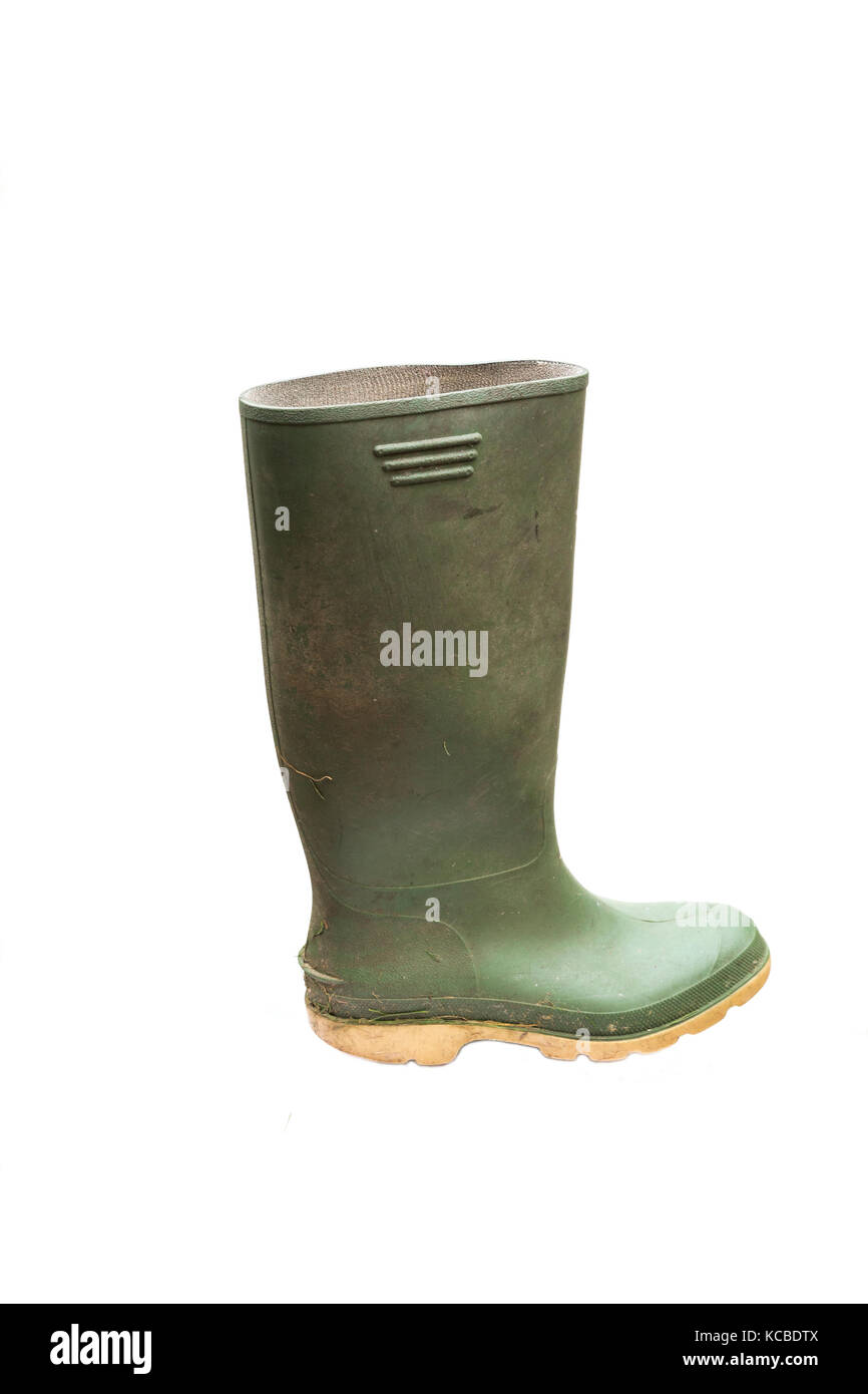 dirty green wellington boot isolated on white background Stock Photo
