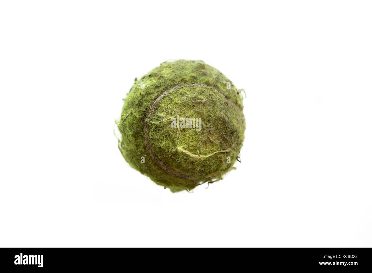 old tatty tennis ball isolated on white background Stock Photo