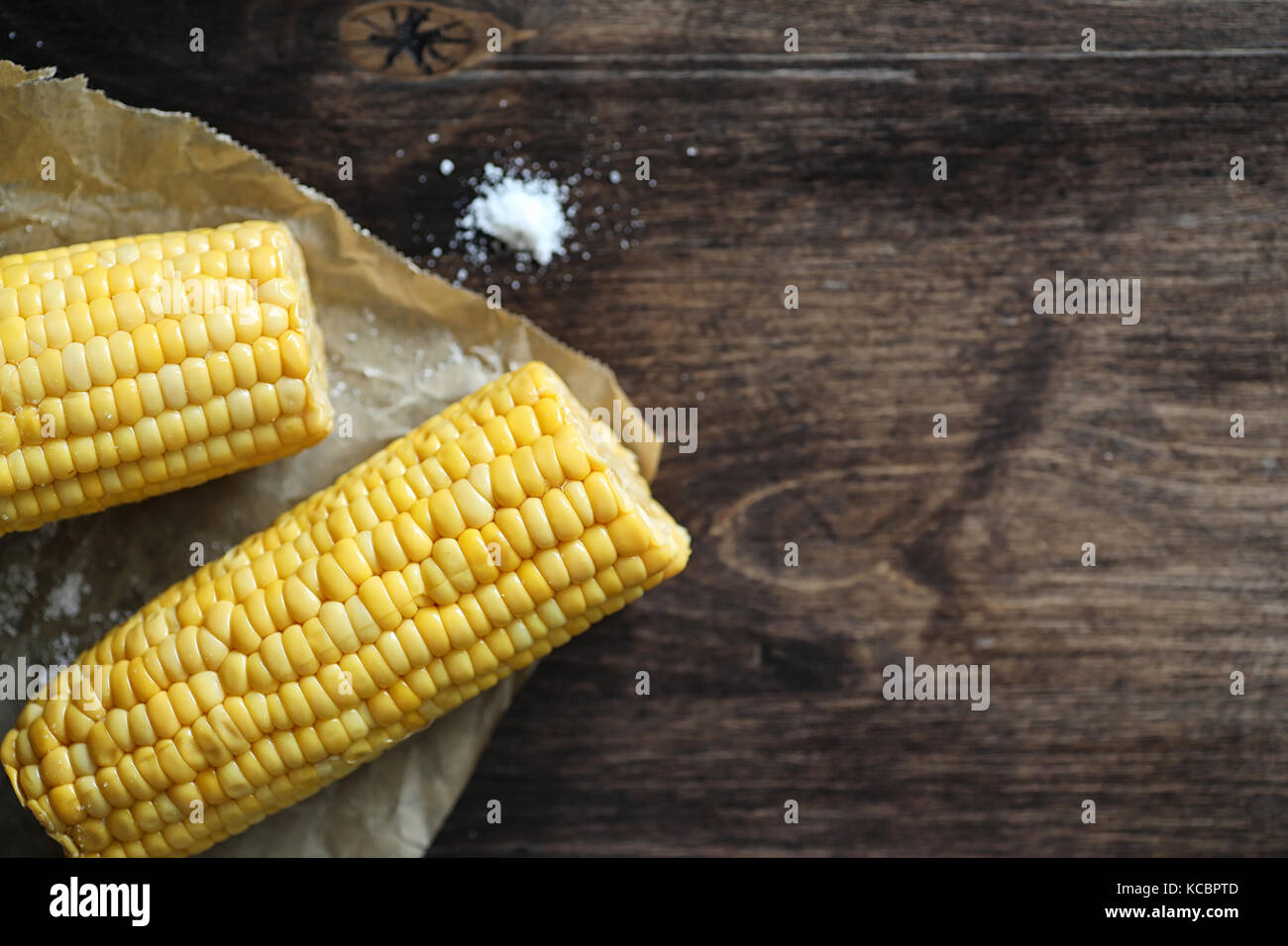 Boiled corn cob with salt on a wood Stock Photo Alamy