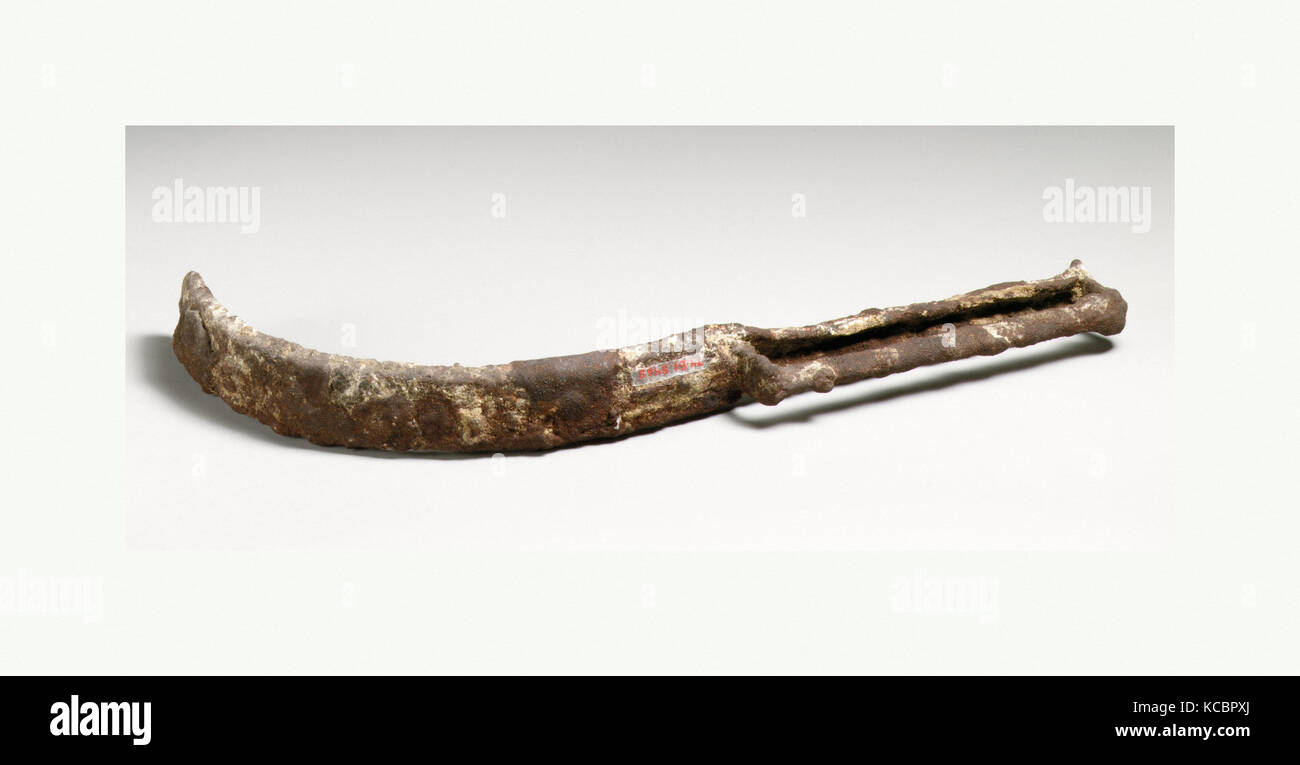 Strigil, Roman, Cypriot, Iron, Other: 9 3/4in. (24.8cm), Bronzes, Broad blade with long, leaf-shaped attachment riveted on Stock Photo