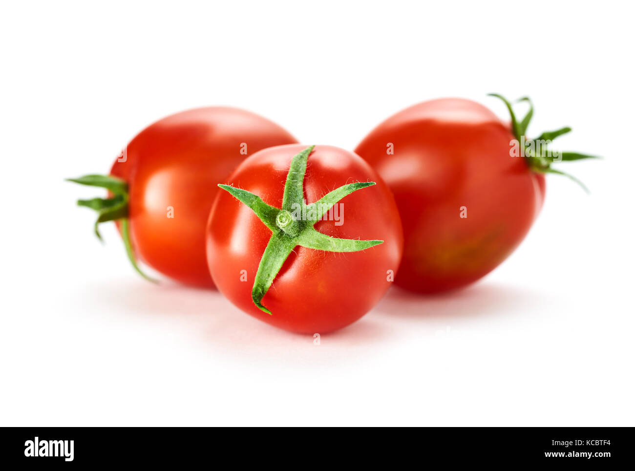 Three fresh ripe red tomatoes isolated on a white background Stock ...