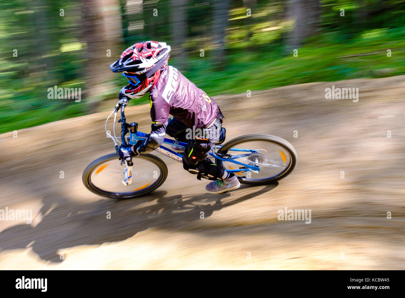 Child 9 years old rides on a mountain 