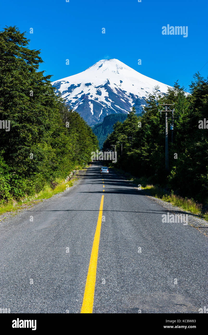 Road leading to the snowcapped volcano Villarrica, Pucon, southern Chile, Chile Stock Photo