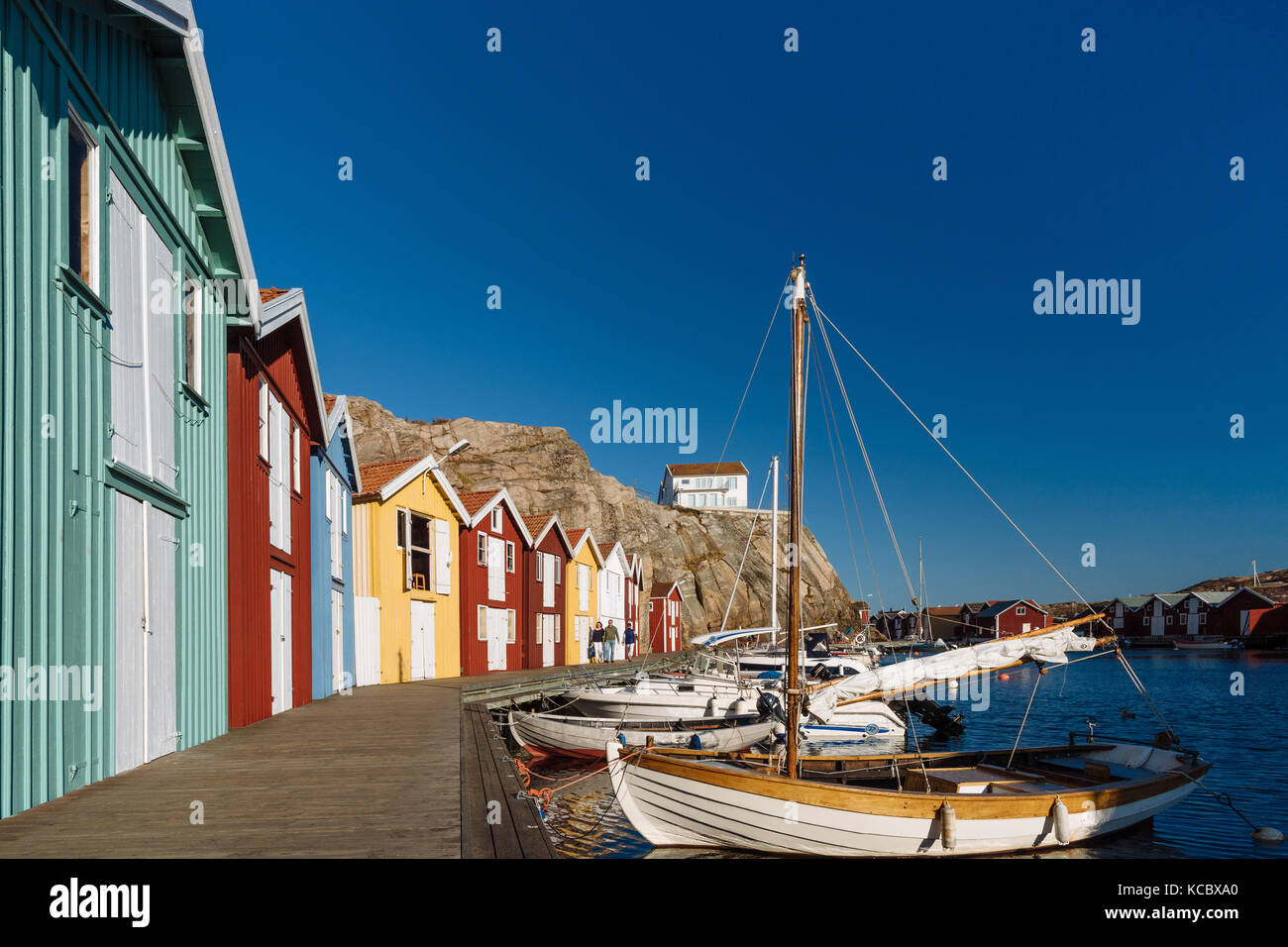 Boats and colourful boathouses in the harbour of Smögen, Smögenbryggan ...
