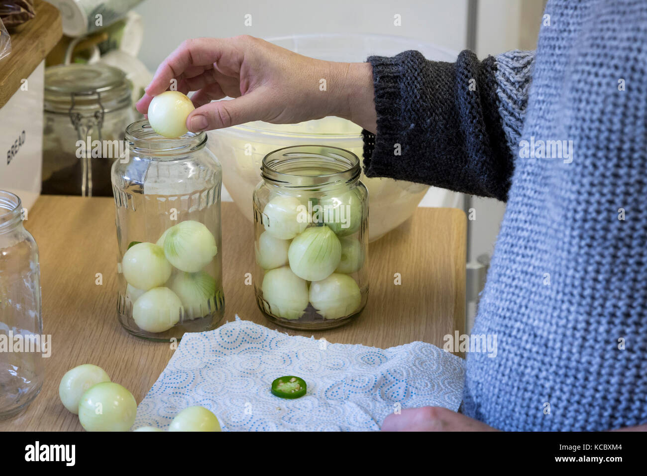 pickling onions in kitchen Stock Photo