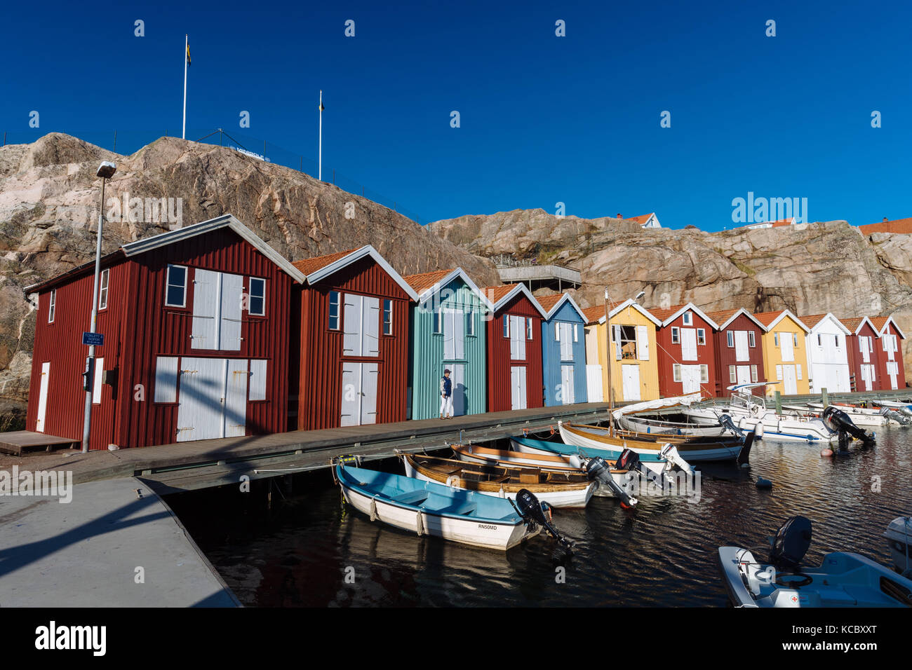 Boats and colourful boathouses in the harbour of Smögen, Smögenbryggan ...