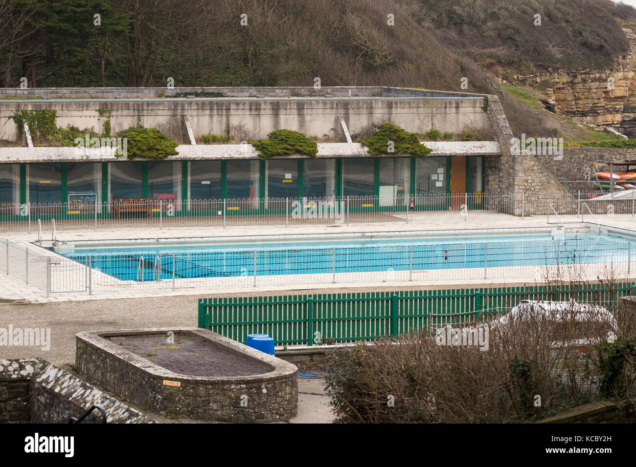 outdoor swimming pool with concrete building Stock Photo