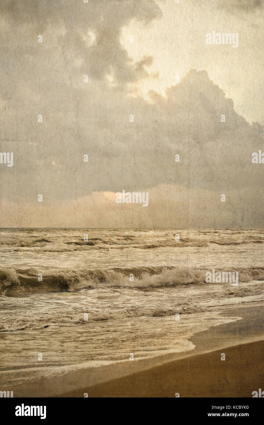 Sea and beach. Vintage style photo with paper texture. Stock Photo