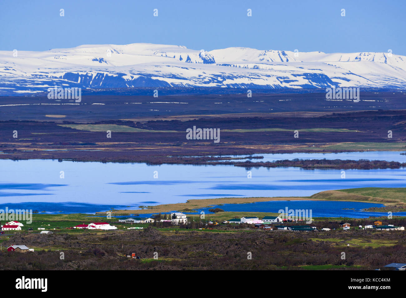 View towards Mývatn lake and snow-capped mountains from Hverfell. Mývatn region, northern Iceland. Stock Photo