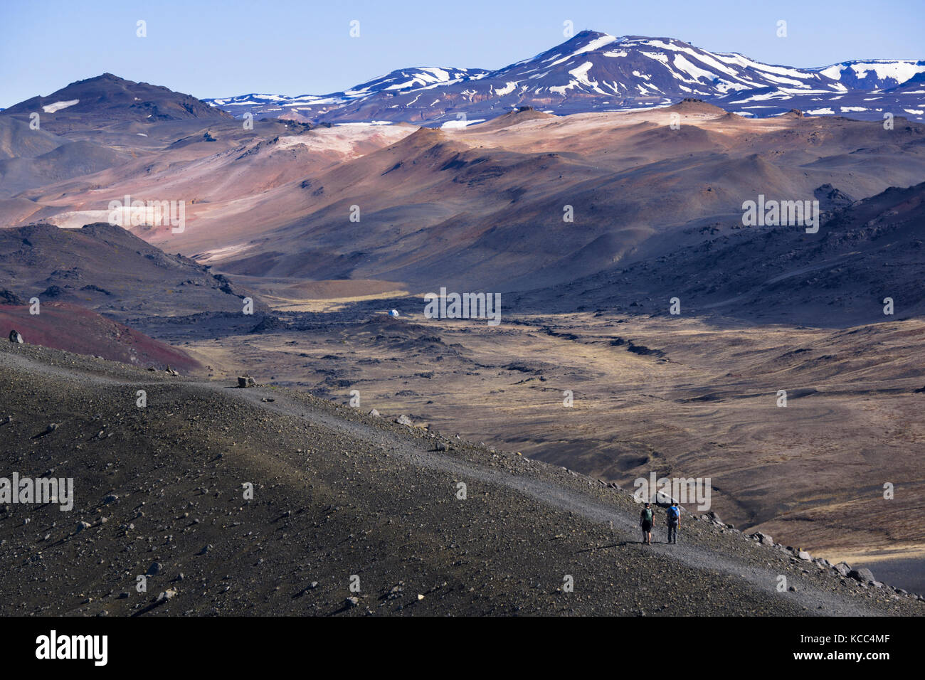 Hikers at Hverfell (also called Hverfjall) tephra cone or tuff ring volcano in northern Iceland, to the east of Mývatn. Stock Photo