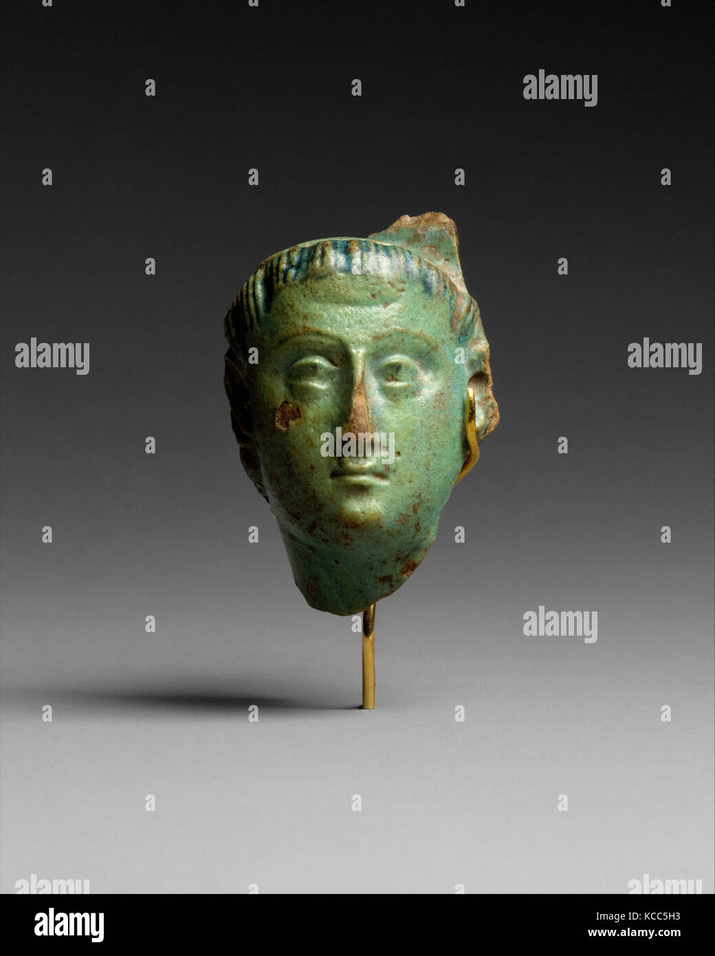 Head, Ptolemy III (?), Ptolemaic Period, 246–222 B.C., From Egypt, Faience, H. 4.4 cm (1 3/4 in.); W. 3 cm (1 3/16 in.); D. 2 Stock Photo