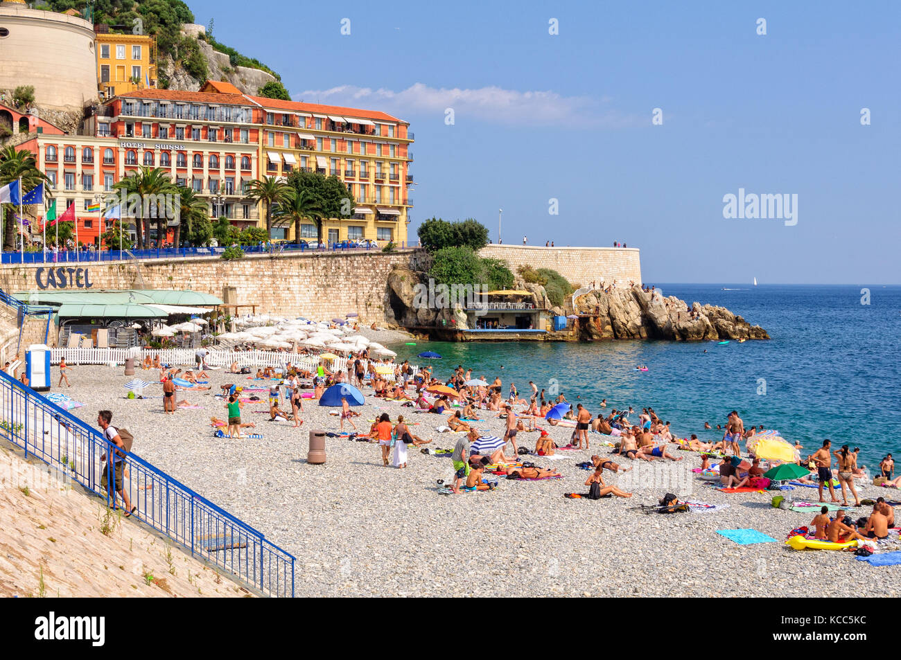 Vacationers enjoy the beautiful weather on Castel Beach - Nice, France Stock Photo