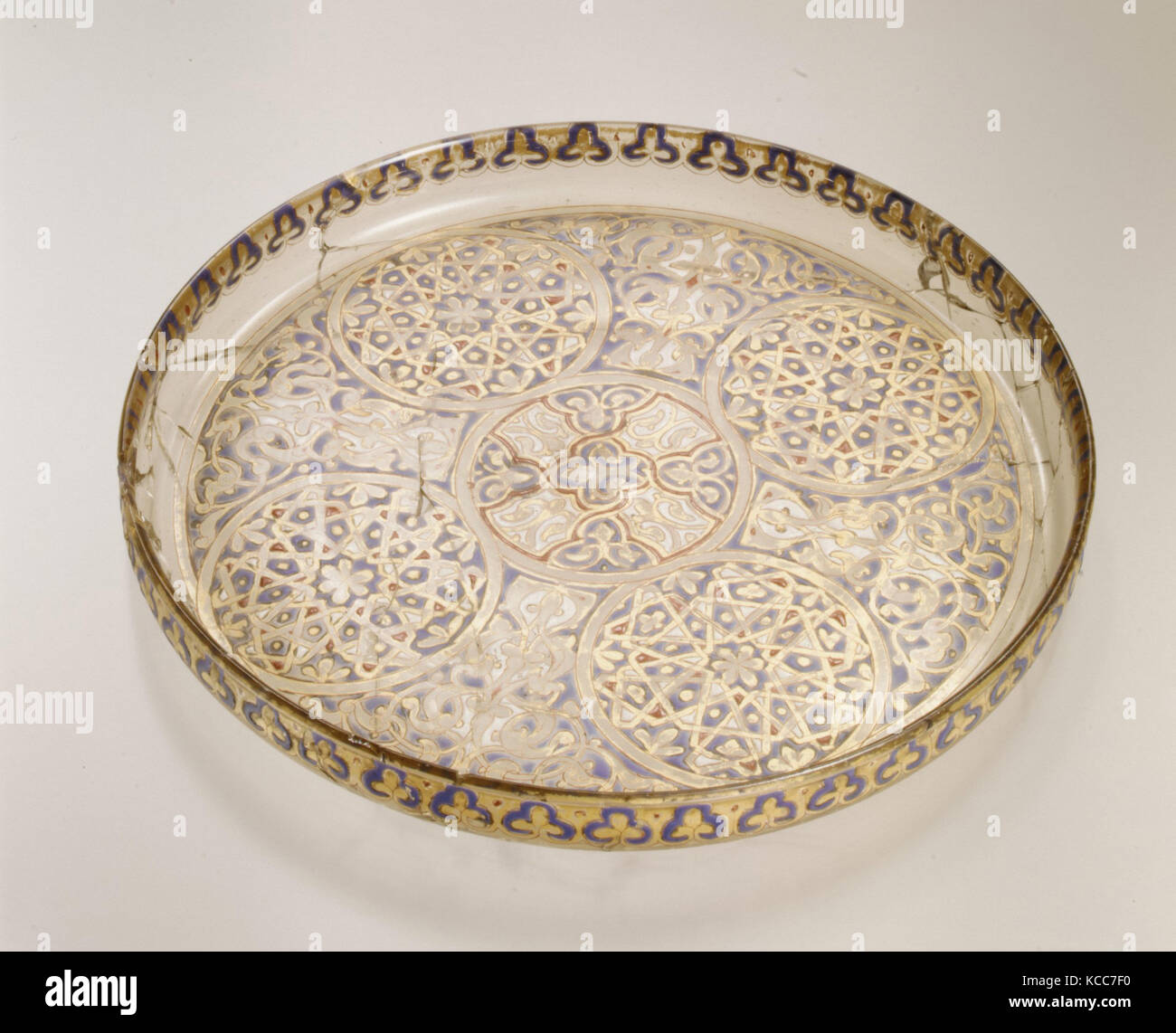 Plate, 14th century, Attributed to Syria, Glass; free blown, enameled and gilded; tooled on the pontil, H. 7/8 in. (2.2 cm Stock Photo