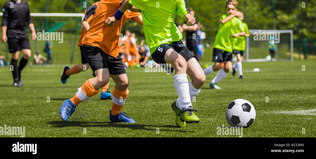 Young Boys Playing Soccer Football Match on Pitch. Kids Running and