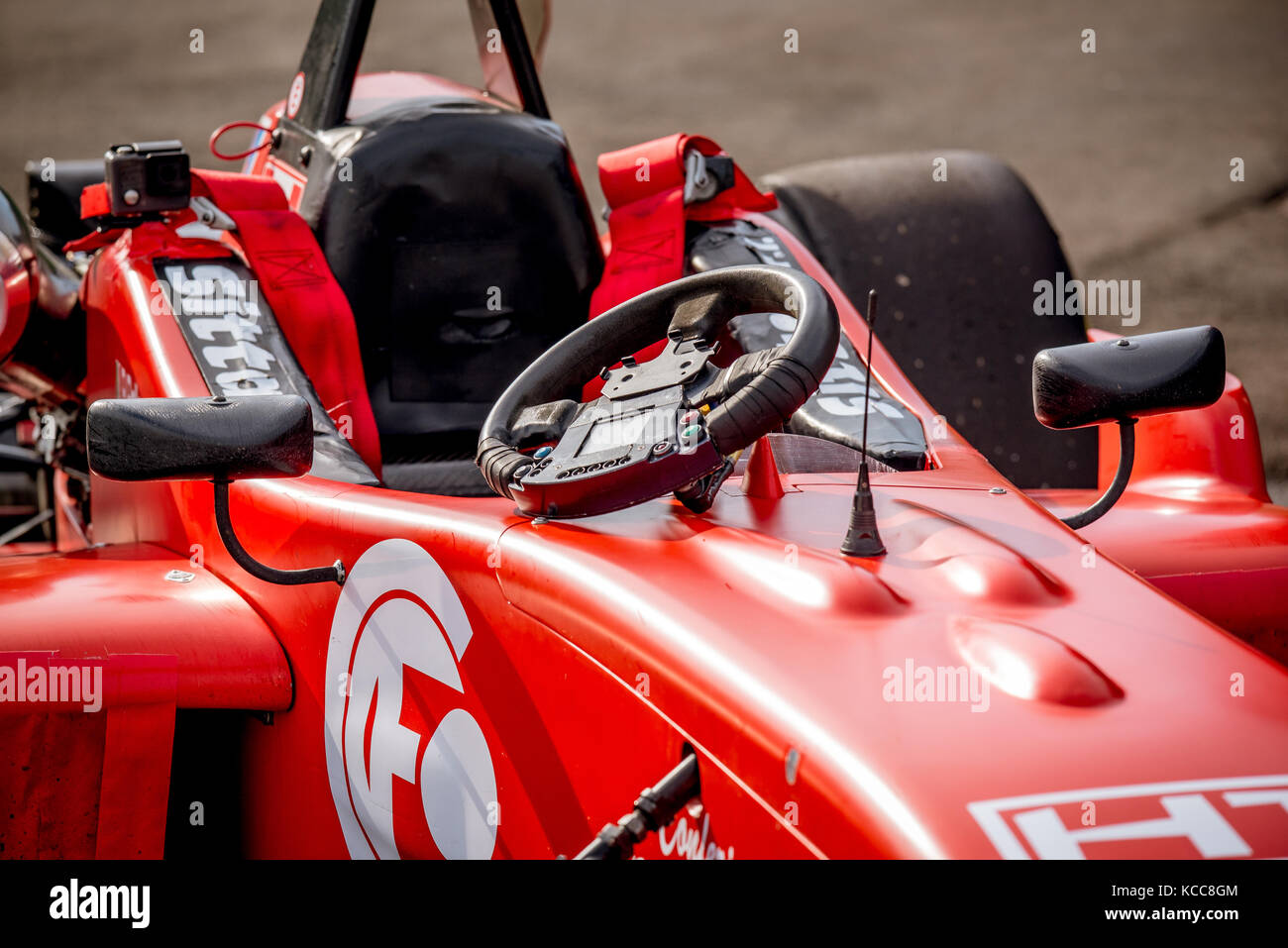 Vallelunga, Italy september 24 2017. Single seater formula racing red car with black steering wheel out of cockpit Stock Photo