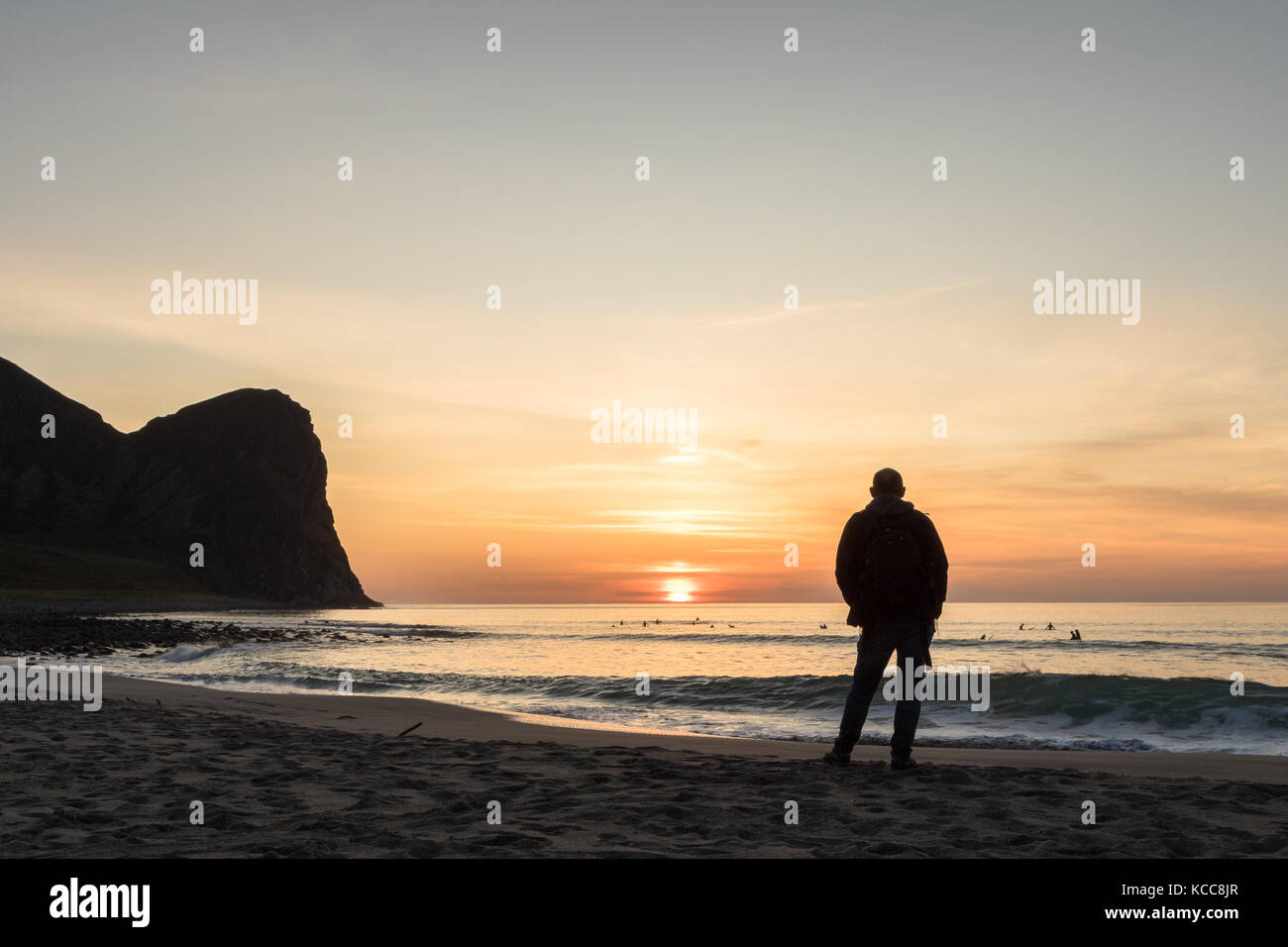 Silhouette of a man at the beautiful sunset on the Unstad beach ...