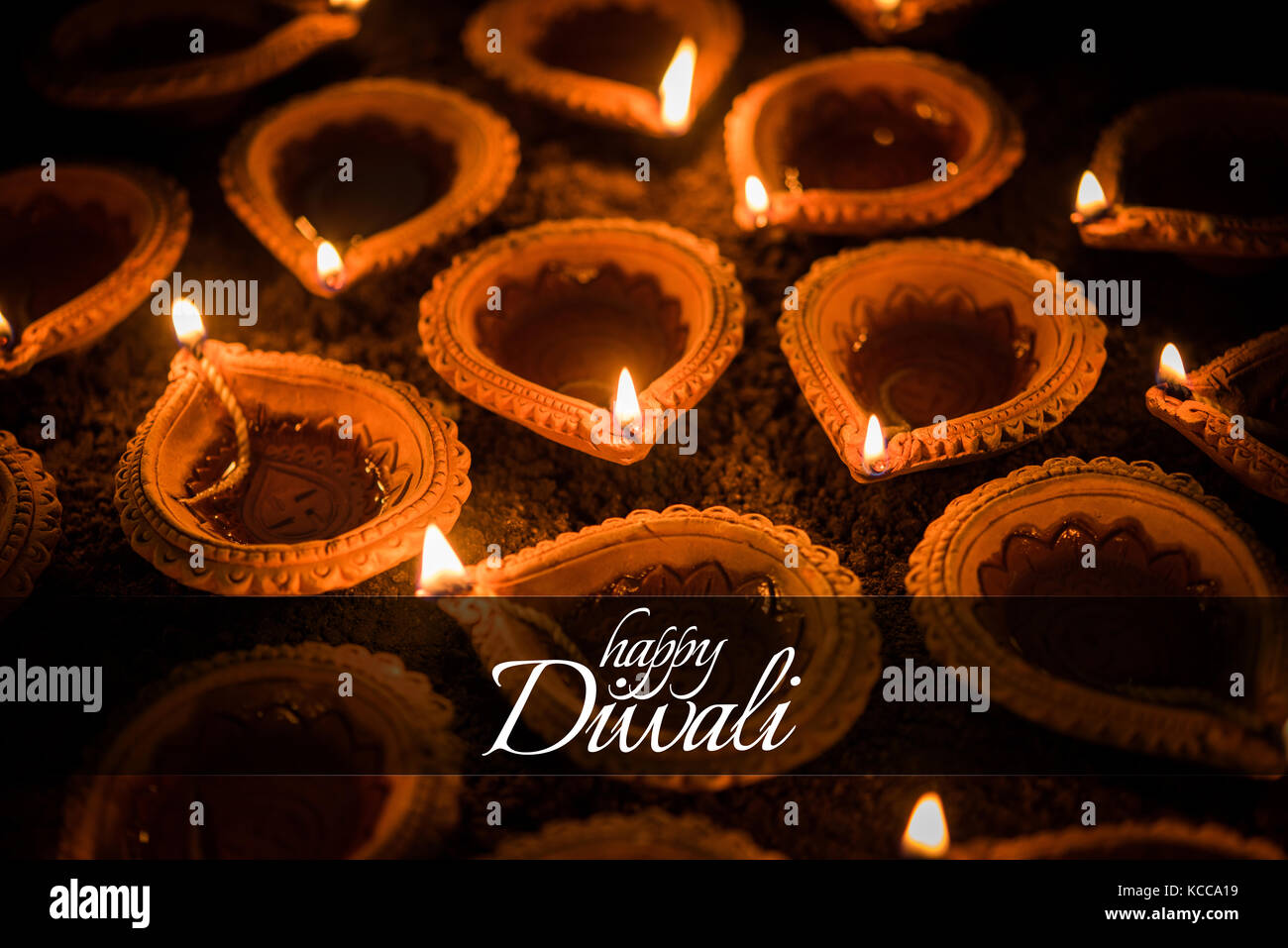 Happy Diwali greeting card design using Beautiful Clay diya lamps ...