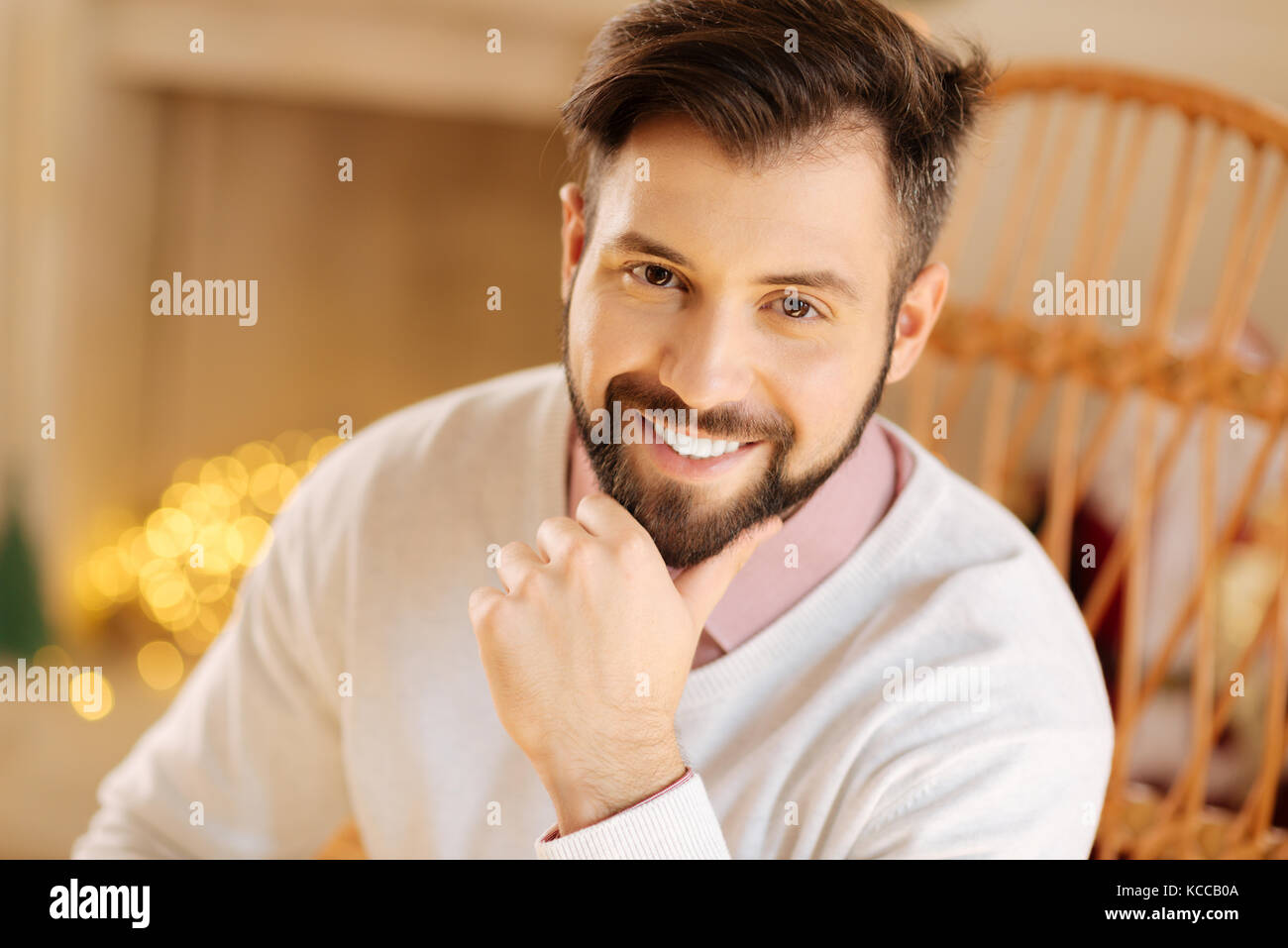 Portrait of dark-haired resting his chin on hand Stock Photo