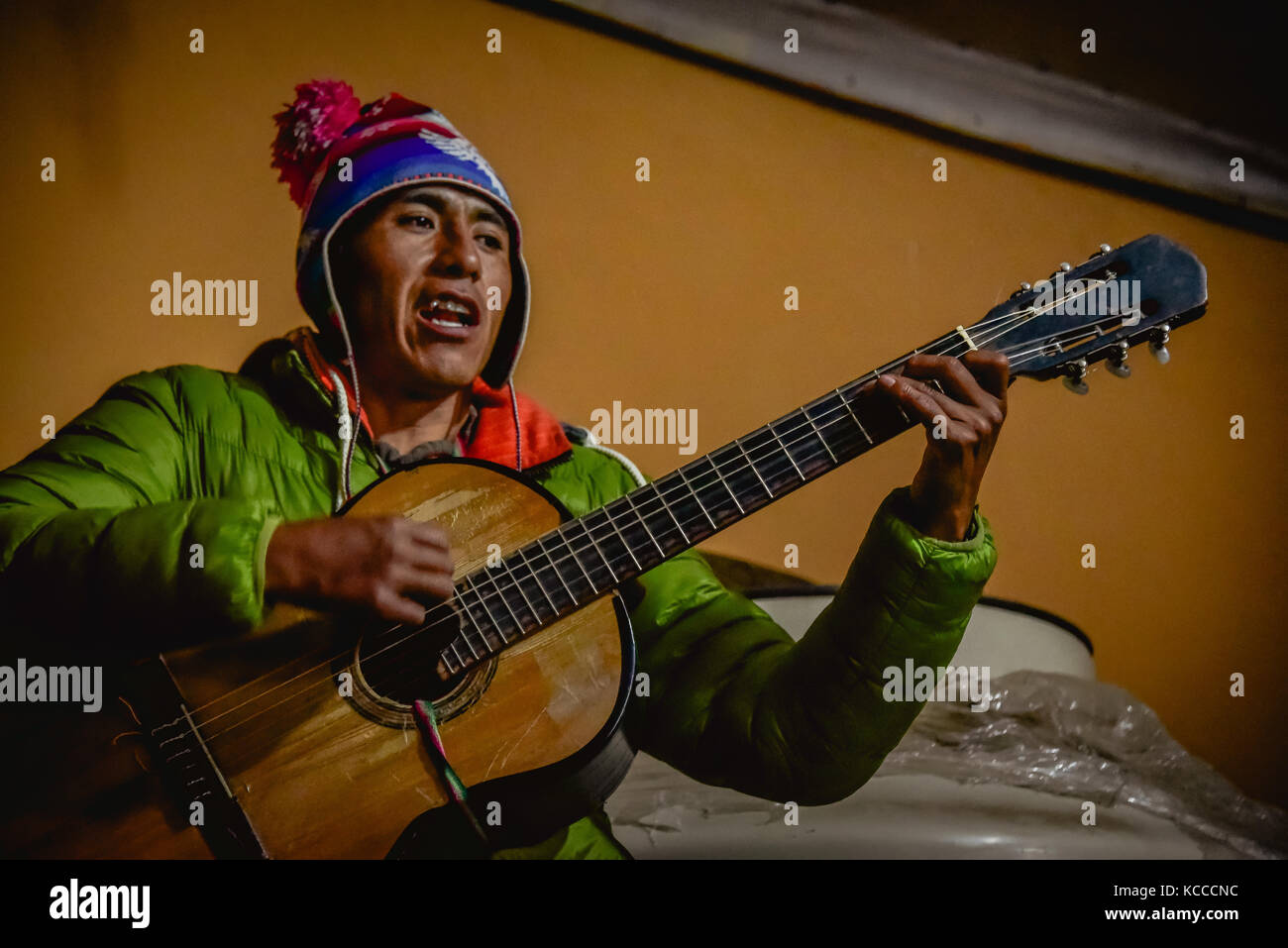 Peruvian man playing spanish guitar Stock Photo