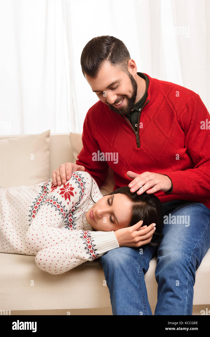 girl sleeping on knees of boyfriend Stock Photo Alamy