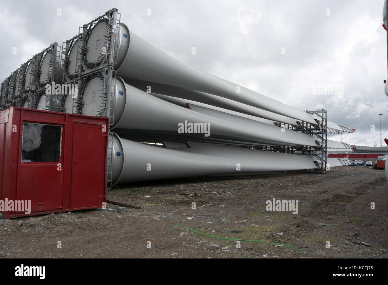 Red Cabin and Wind Turbine Blades Stock Photo
