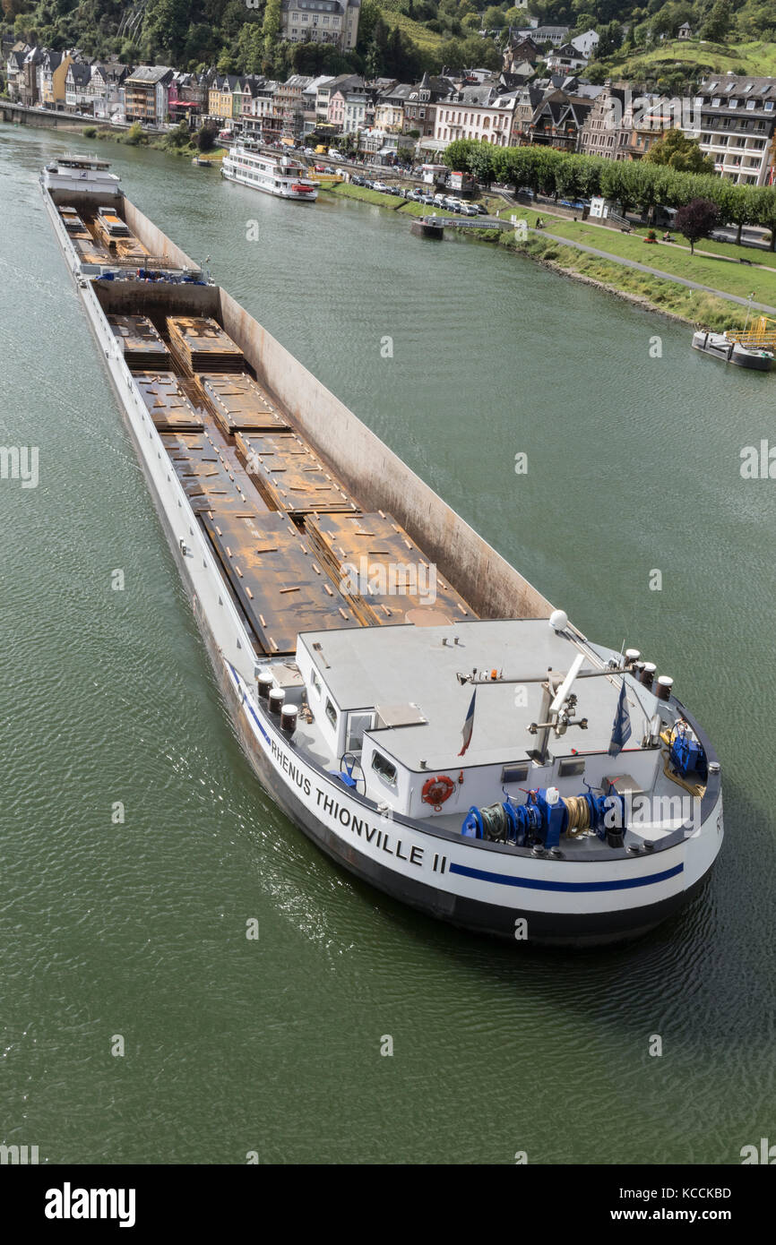 A barge, Rhenus Thionville 11, carrying sheet metal at Cochem, Mosel Valley, Germany Stock Photo