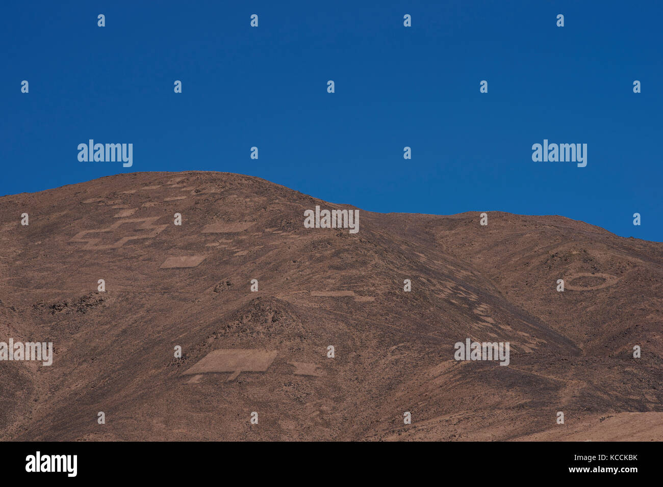 Large group of ancient petroglyphs on the hillsides at Cerro Pintados in the Atacama Desert in the Tarapaca Region of northern Chile. Stock Photo