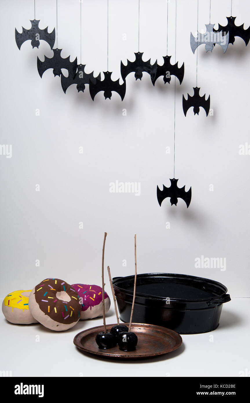 halloween with brightly painted pumpkins and bats silhouettes on a ...
