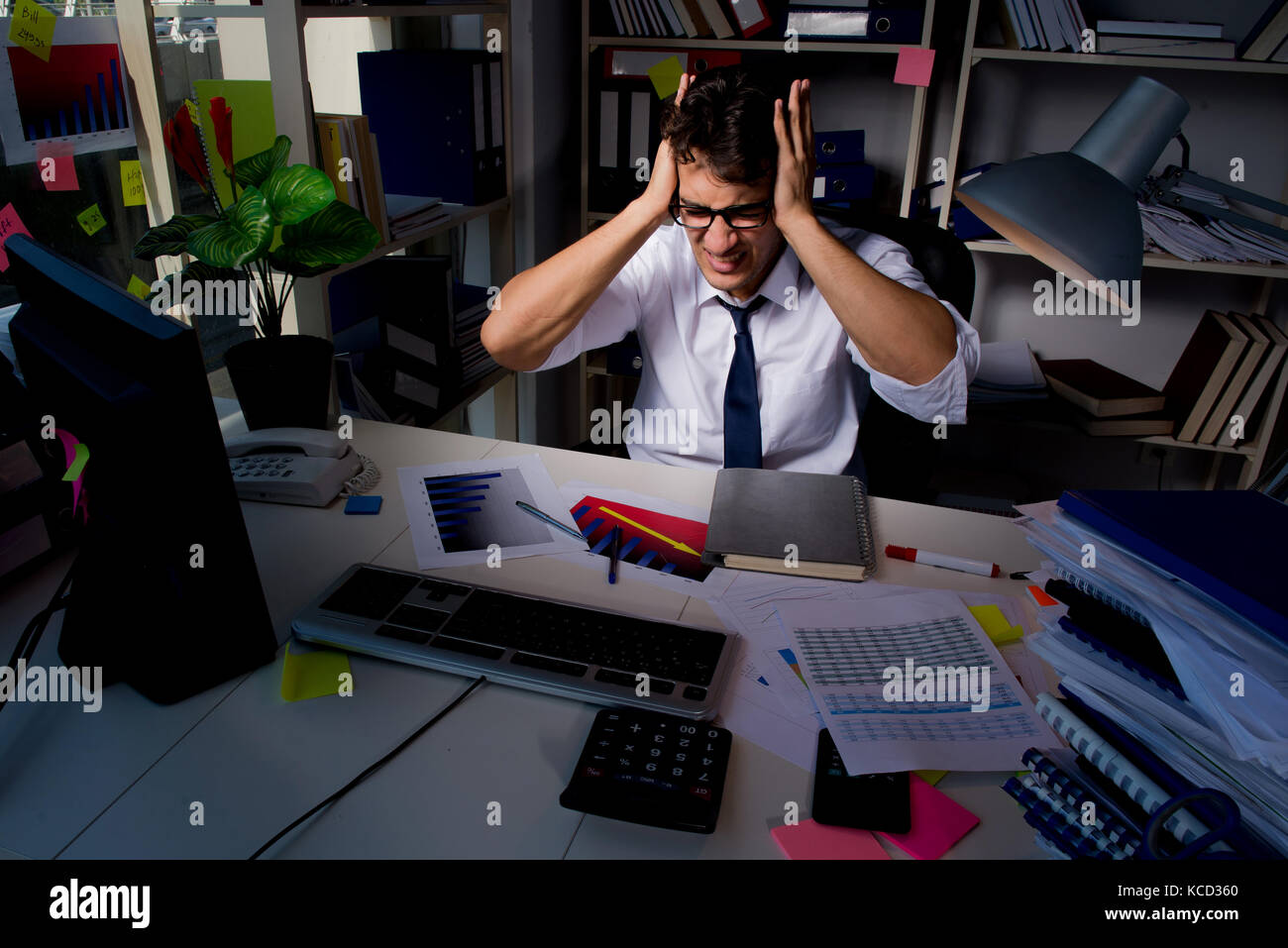 Man businessman working late hours in the office Stock Photo Alamy