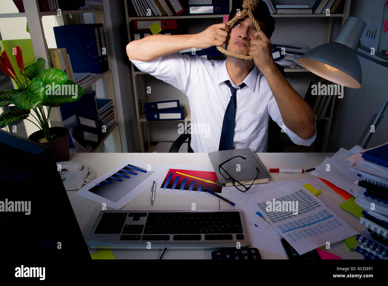 Man businessman working late hours in the office Stock Photo Alamy