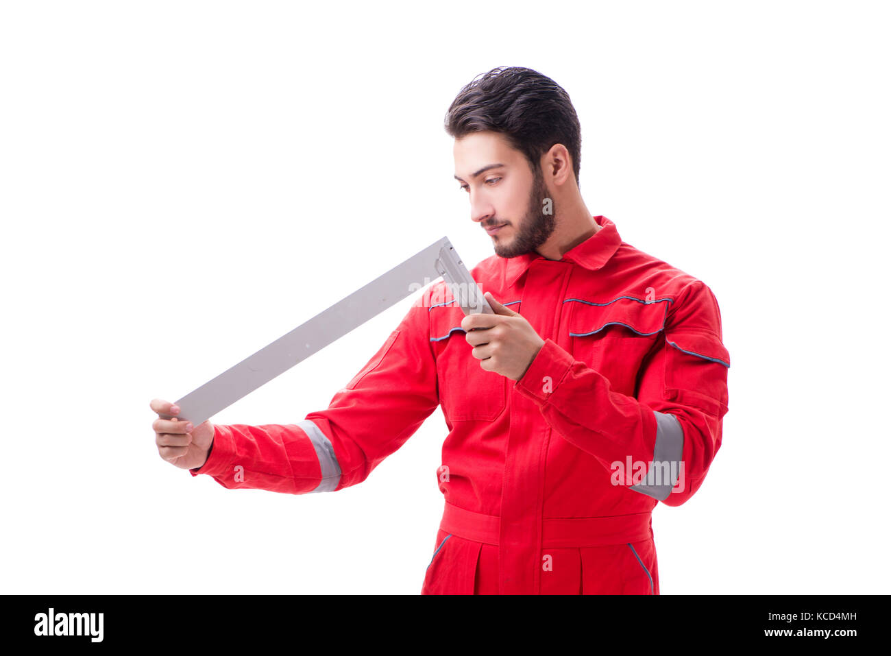 Young repairman with a square ruler isolated on white background Stock ...