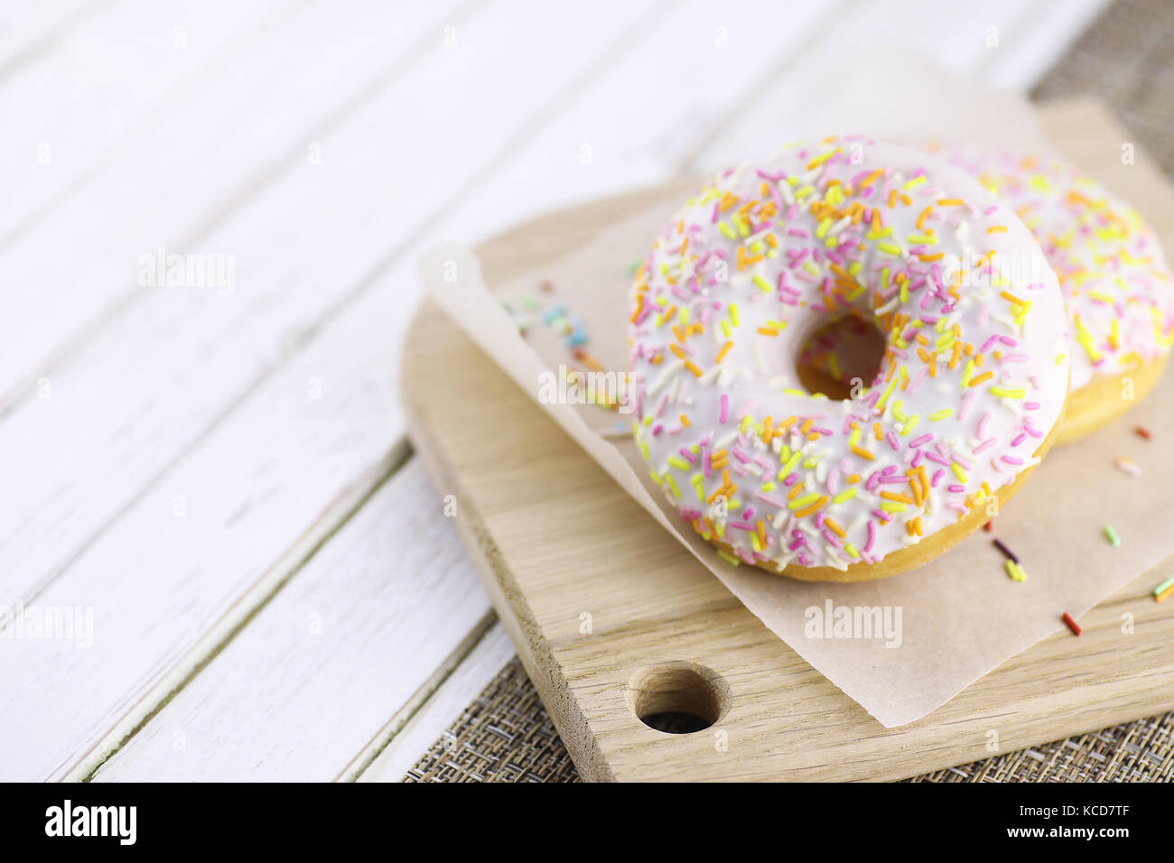 Donut on a wooden white background Stock Photo - Alamy
