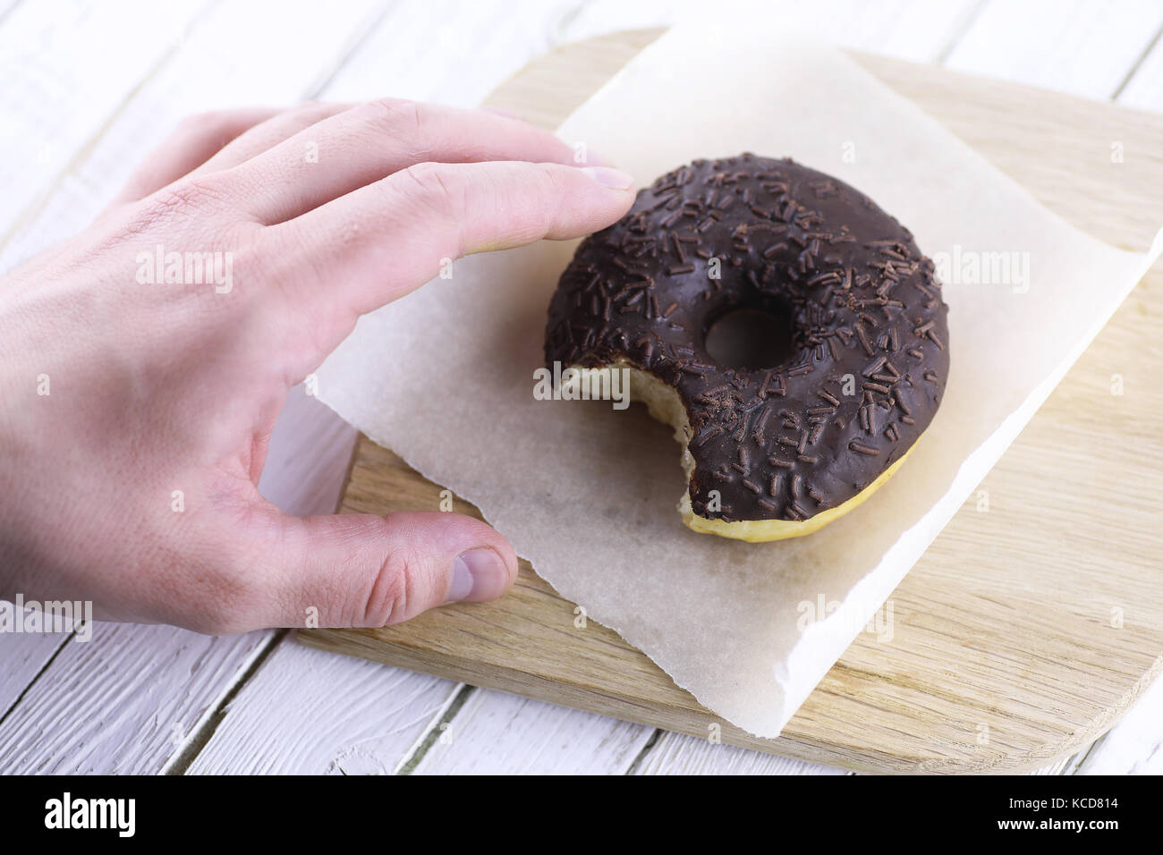 Chocolate Donut on a wooden white background Stock Photo - Alamy