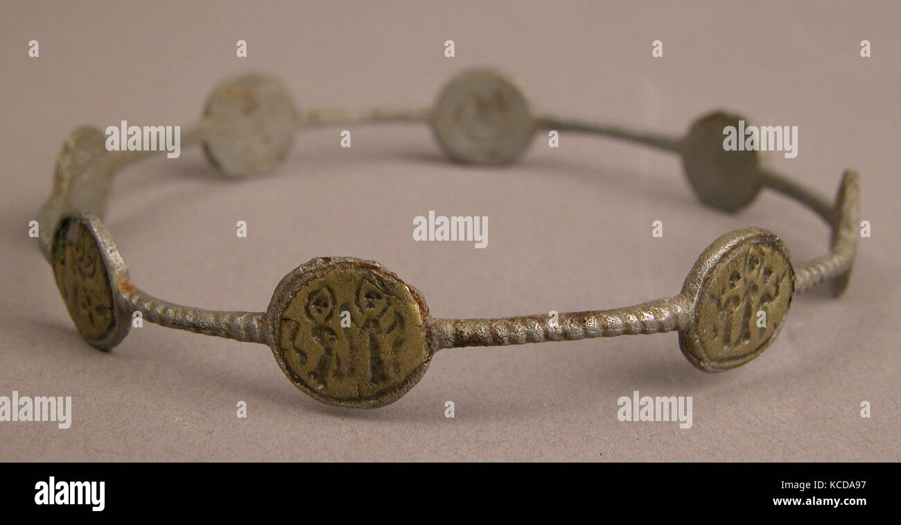Bracelet with Holy Figures, 5th–7th century, Found Egypt, Maghagha, Iron; inlaid with copper disks, Diam. 3 1/8 in. (7.9 cm Stock Photo