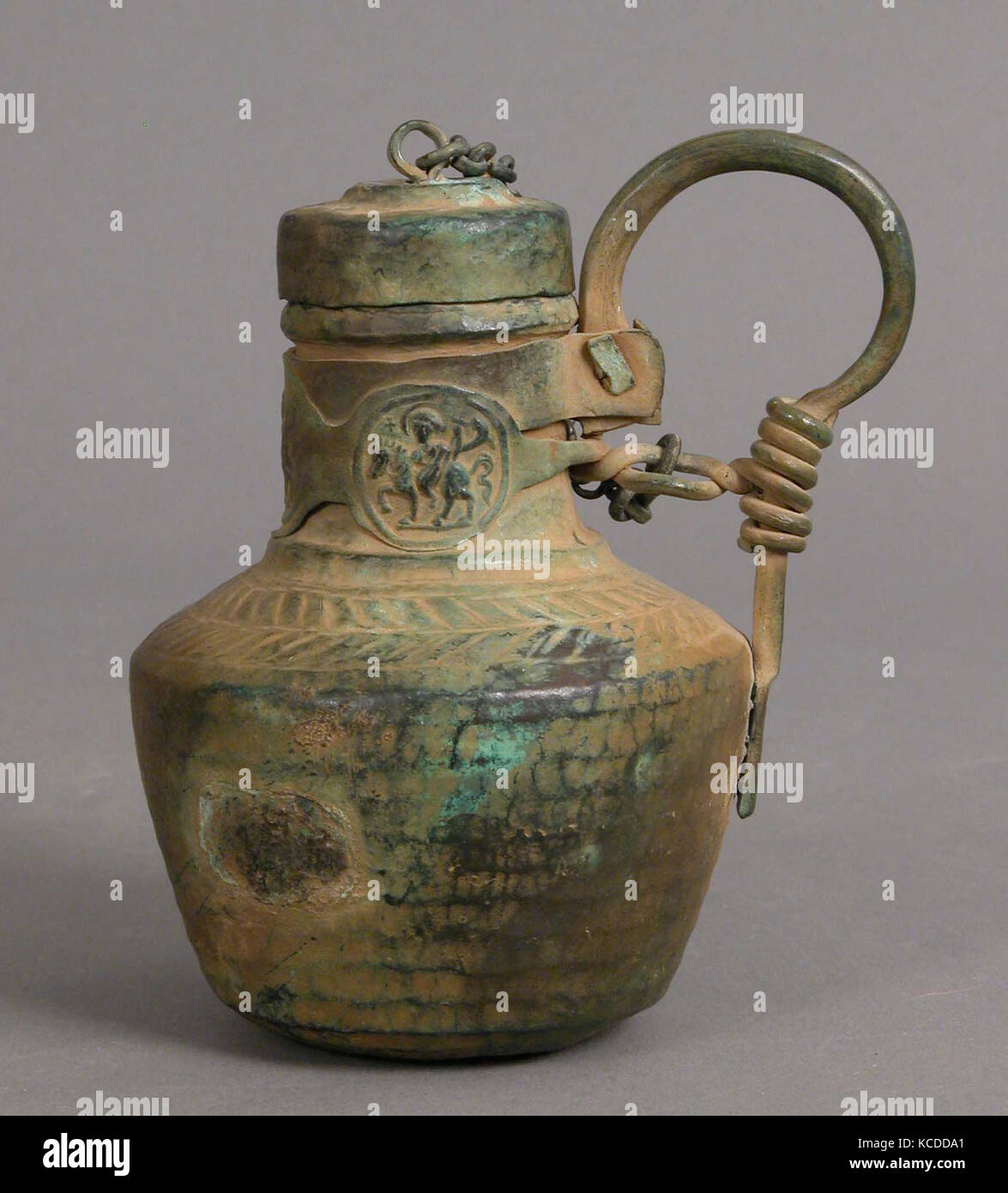Jug with Medallions, 6th–8th century, Byzantine, Copper alloy, Overall: 4 15/16 x 4 x 3 3/8 in. (12.5 x 10.2 x 8.6 cm), Metal Stock Photo