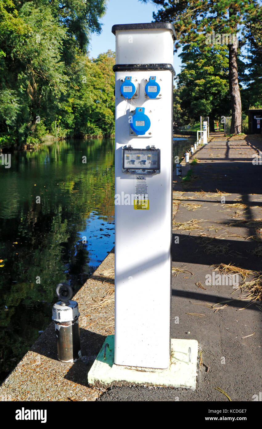 Boat moorings and service point by the River Wensum in Norwich, Norfolk, England, United Kingdom. Stock Photo