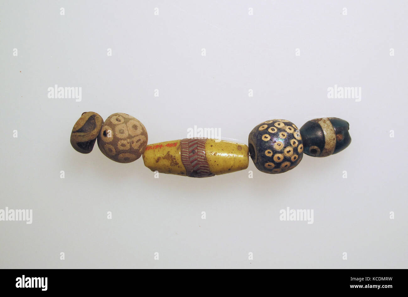 Beads, 5, Roman, Glass, Other: 5/8 x 3 7/16 in. (1.7 x 8.7 cm), Glass, Eye beads with wavy lines Stock Photo