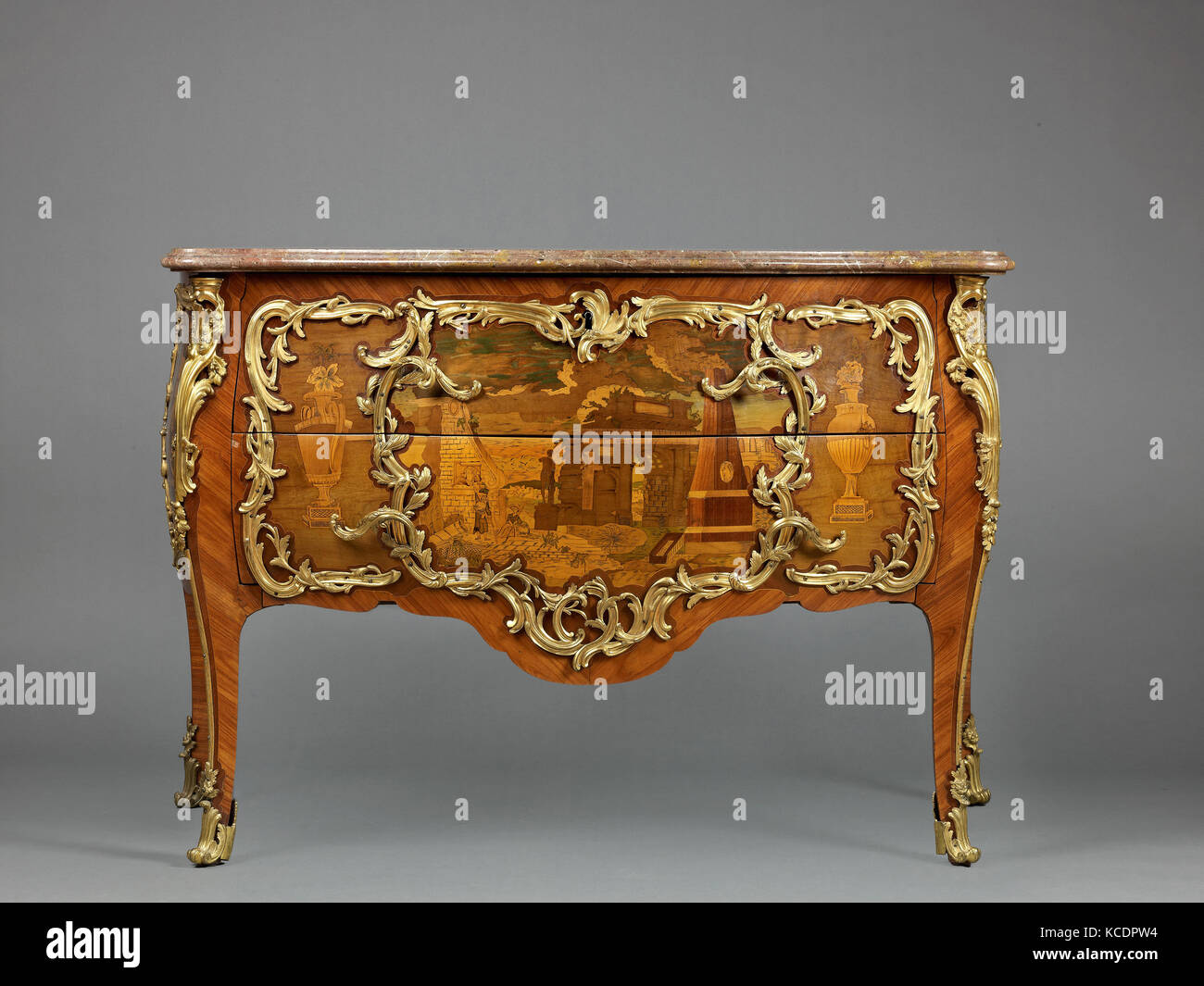 Commode, ca. 1765–70, Oak and pine veneered with stained maple, tulipwood, amaranth, and holly stringing, with marquetry of Stock Photo