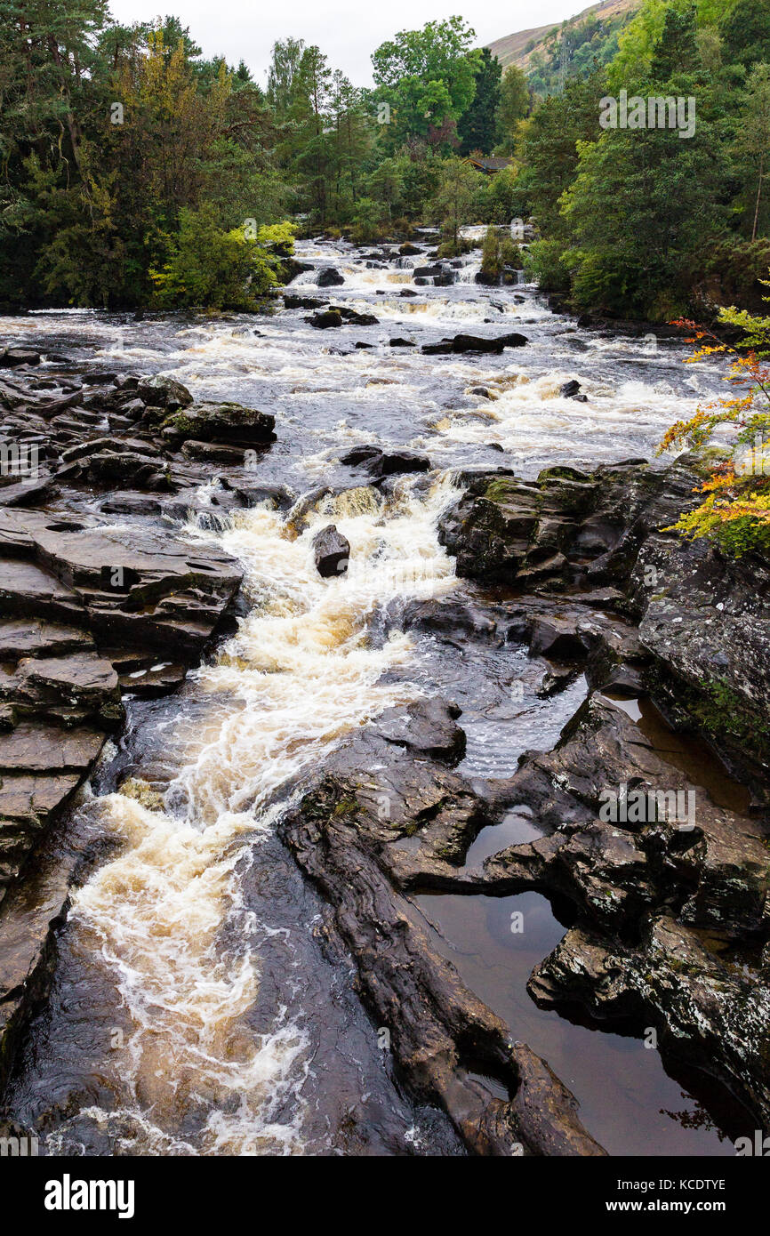The Falls of Dochart run through the small town of Killin, in Loch Lomond & The Trossachs National Park, Scotland. Stock Photo
