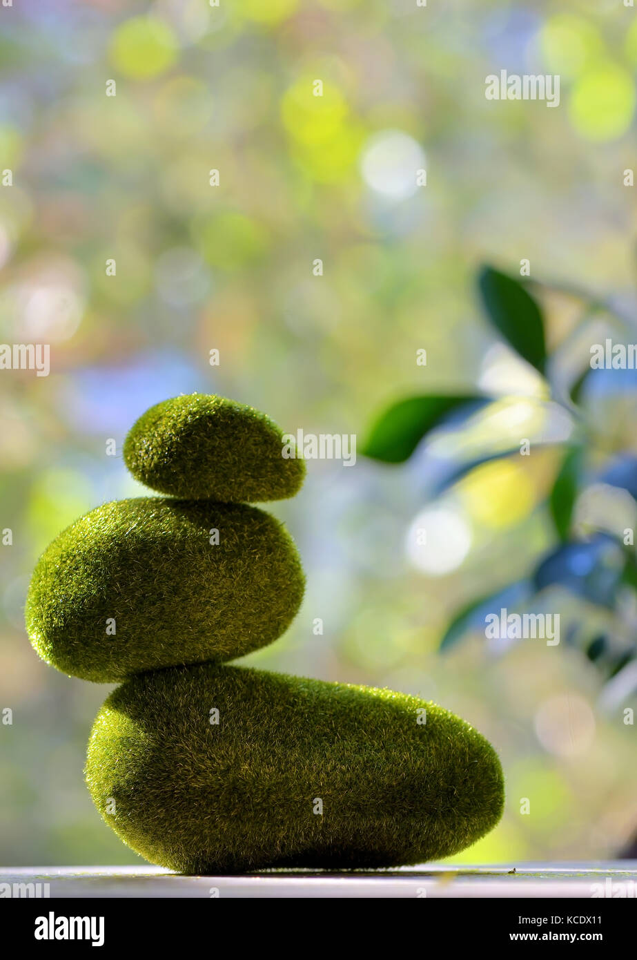 Pyramid from pebbles covered with grass Stock Photo Alamy