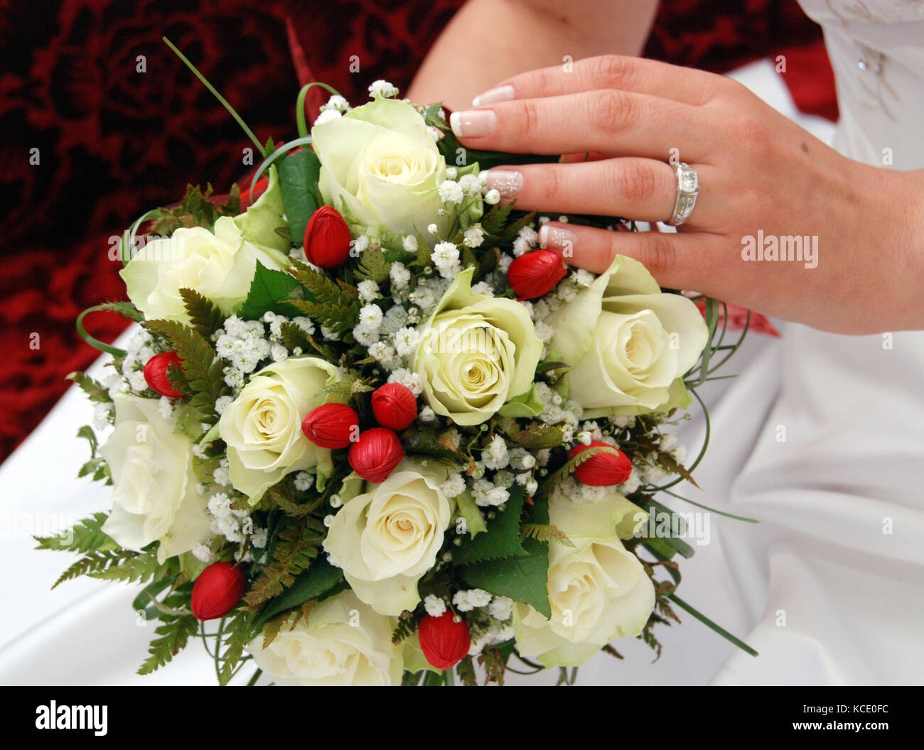 picture of a bride hold bouquet with white roses Stock Photo - Alamy