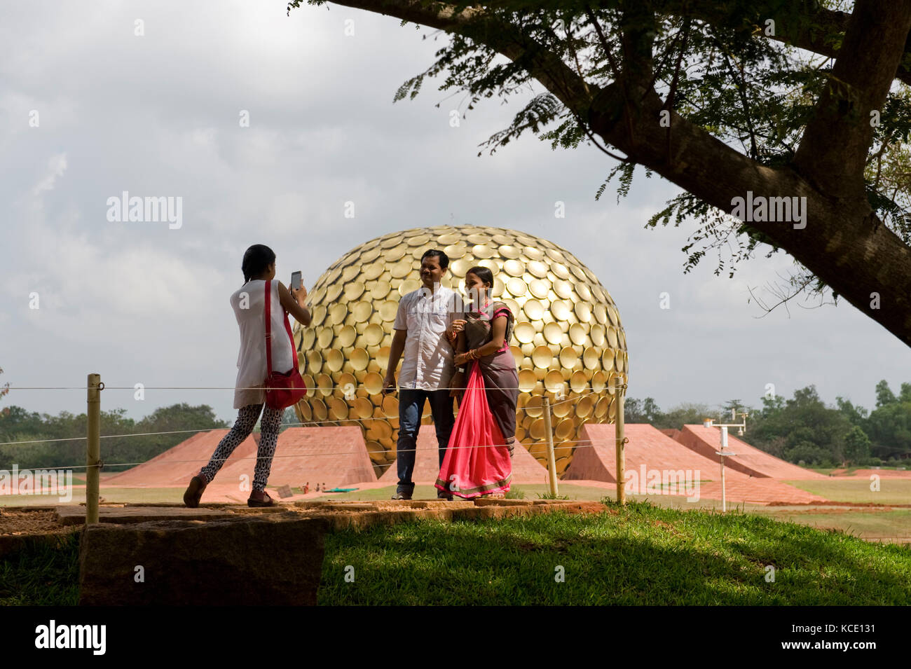 AUROVILLE, INDIA: Tourists in front of the Matrimandir, the meditation ...